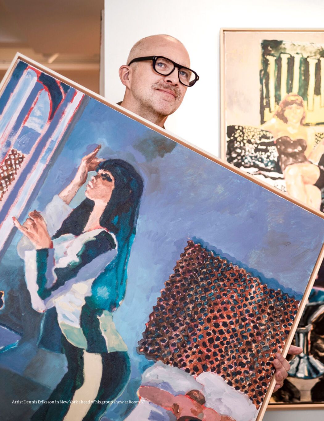 The illustrator Dennis Eriksson with his hand-painted artwork