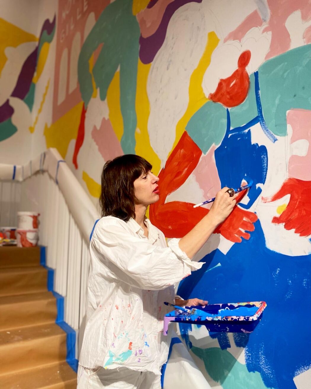 Mural-painting process by illustration artist Erica Jacobson at Sven-Harrys Art Museum.